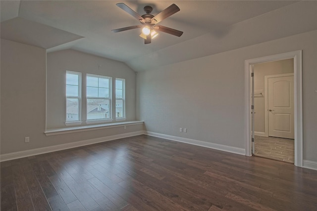 unfurnished room with vaulted ceiling, ceiling fan, and dark hardwood / wood-style floors