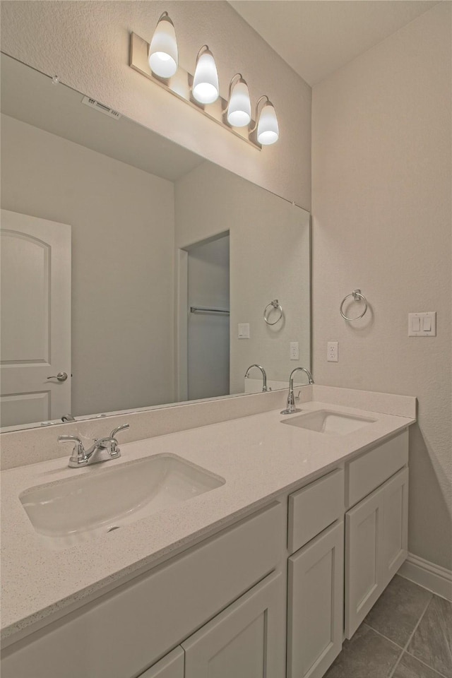 bathroom featuring tile patterned floors and vanity