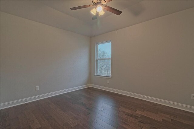 unfurnished room with ceiling fan and dark hardwood / wood-style floors