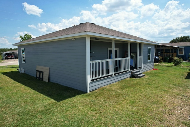 rear view of house with a lawn