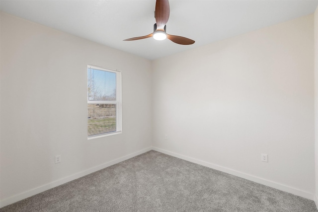 empty room featuring carpet floors and ceiling fan