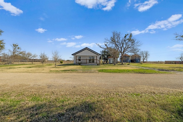 view of yard with a rural view