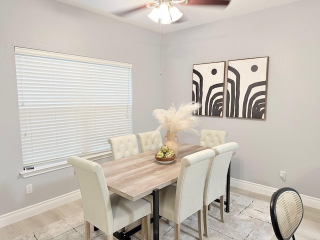 dining area featuring ceiling fan and light hardwood / wood-style flooring