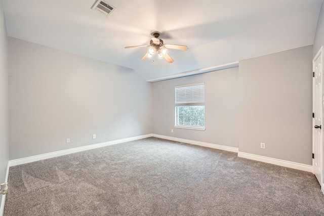 carpeted empty room featuring ceiling fan and lofted ceiling