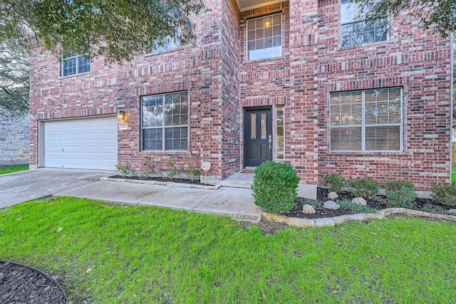 view of exterior entry featuring a garage and a lawn