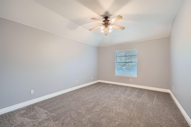 carpeted spare room with lofted ceiling and ceiling fan