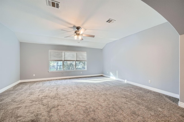 unfurnished room with ceiling fan, carpet, and lofted ceiling