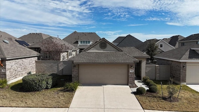 view of front of home featuring a garage and a front yard