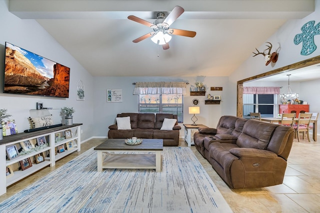 living room featuring ceiling fan, lofted ceiling with beams, and light tile patterned flooring