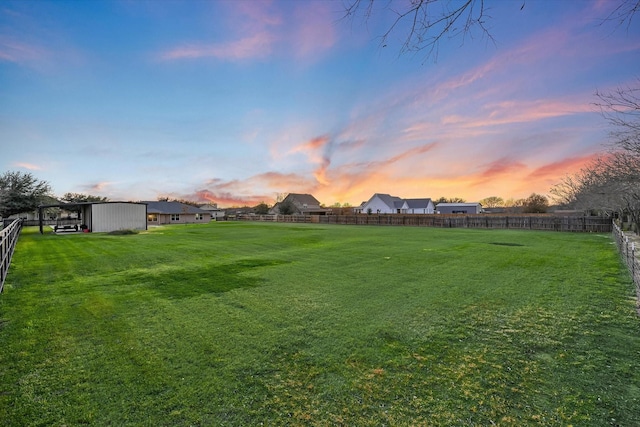 view of yard at dusk