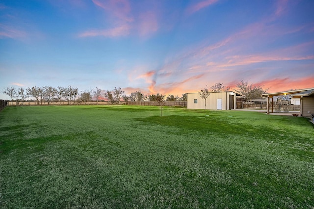 view of yard at dusk