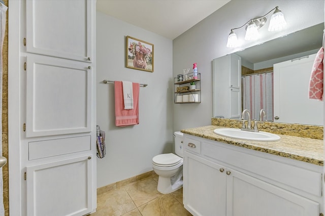 bathroom featuring curtained shower, tile patterned floors, vanity, and toilet