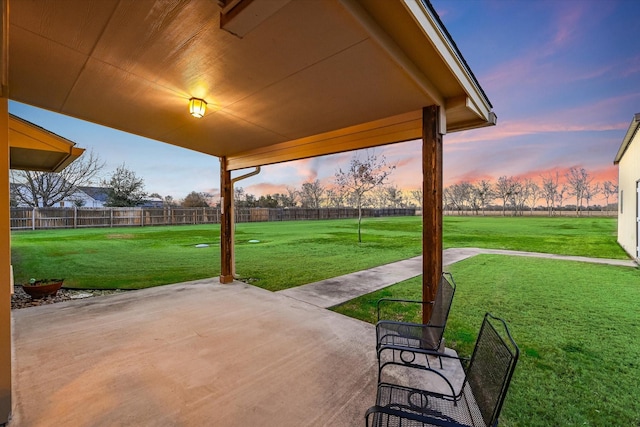 patio terrace at dusk with a lawn