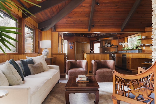 living room featuring plenty of natural light, wood ceiling, and wooden walls