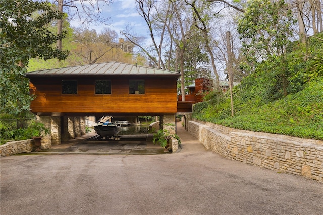 view of side of property featuring a carport