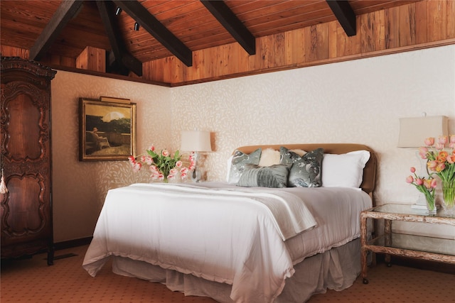 carpeted bedroom with lofted ceiling with beams, wood ceiling, and wooden walls