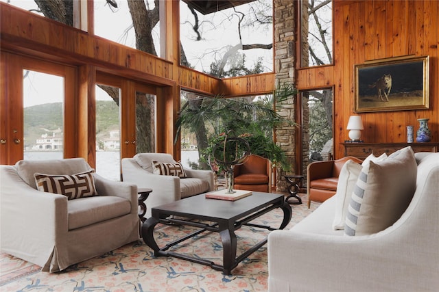 sunroom / solarium featuring french doors