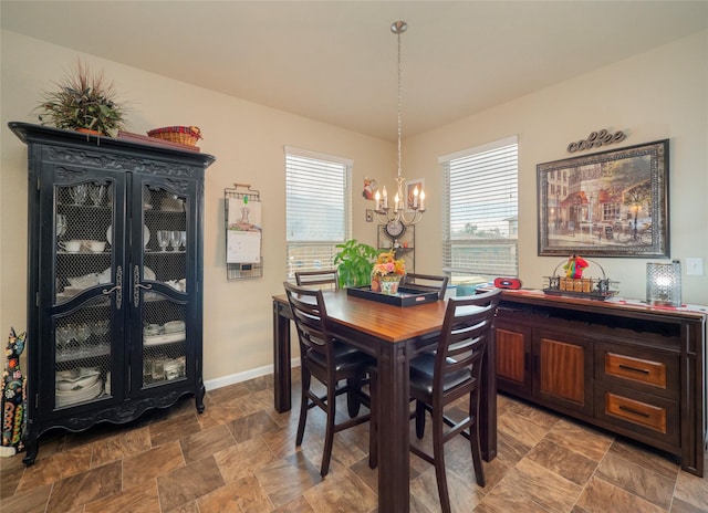 dining space featuring a chandelier