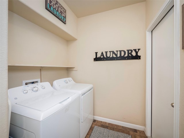 laundry area with washer and dryer and hardwood / wood-style floors