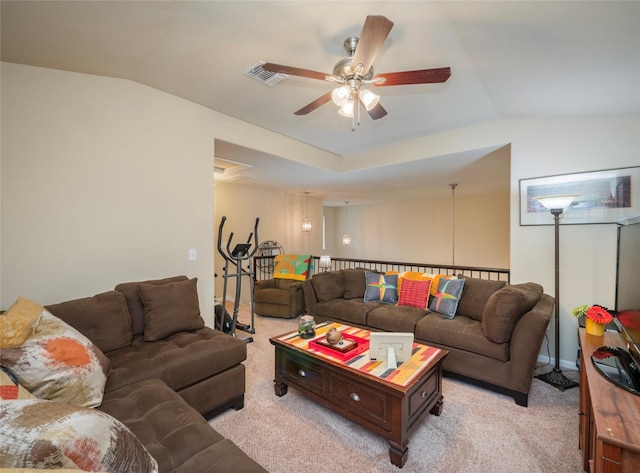 living room with ceiling fan, lofted ceiling, and light colored carpet