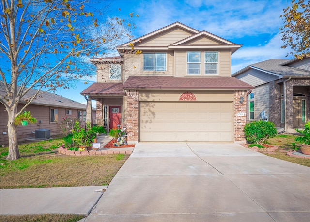 view of front of home featuring a front yard, a garage, and central AC