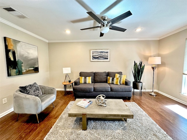 living room with crown molding, hardwood / wood-style floors, and ceiling fan