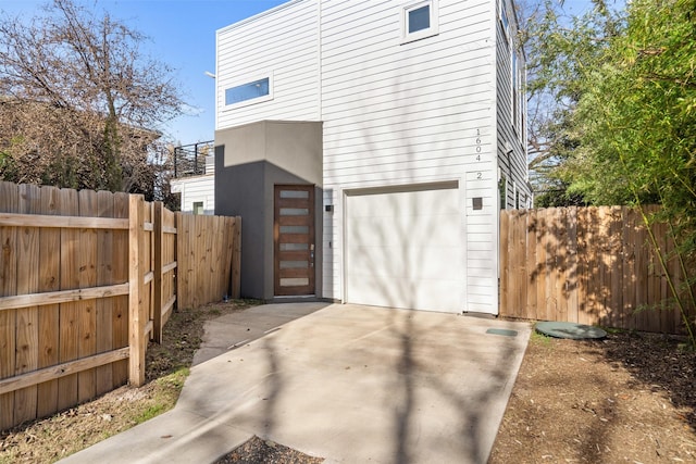 view of side of property with a garage