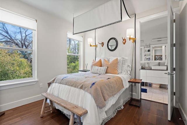 bedroom featuring dark wood-type flooring and multiple windows