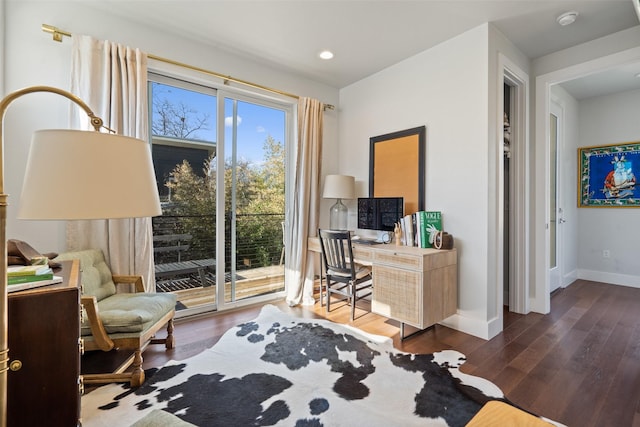 office with dark hardwood / wood-style floors