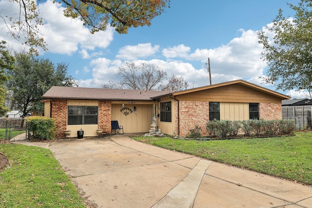 ranch-style home with a front lawn