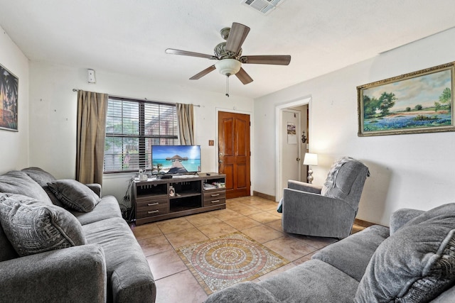 living room with ceiling fan and light tile patterned floors