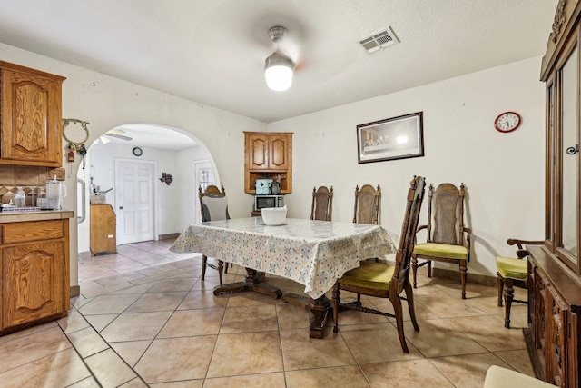 dining space with light tile patterned flooring