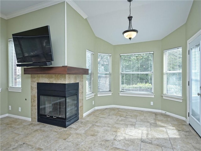 unfurnished living room featuring crown molding, plenty of natural light, and a fireplace