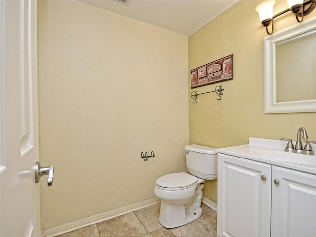 bathroom with tile patterned floors, toilet, and vanity