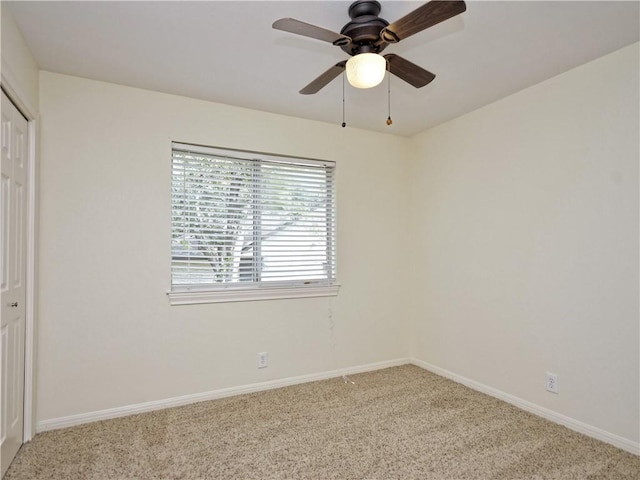 unfurnished bedroom featuring a closet, ceiling fan, and carpet floors