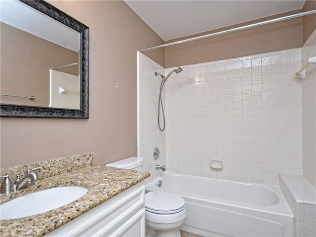 full bathroom featuring washtub / shower combination, toilet, and vanity