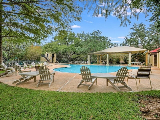 view of swimming pool featuring a patio area