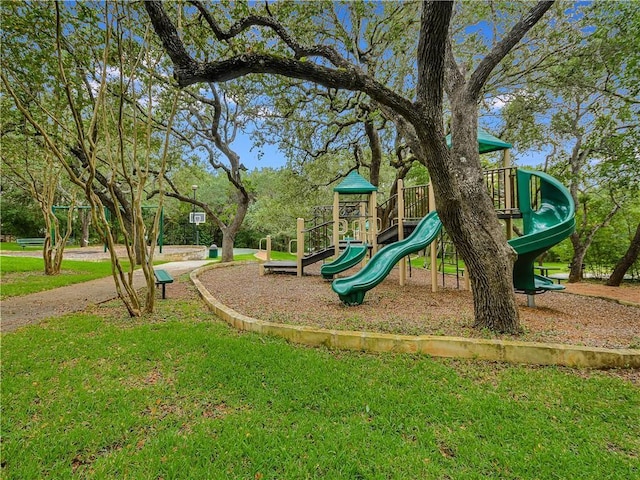 view of jungle gym featuring a lawn