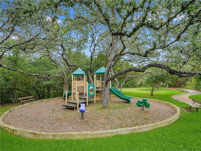 view of playground with a lawn