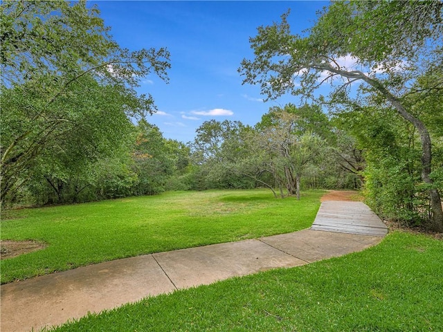 surrounding community featuring a lawn