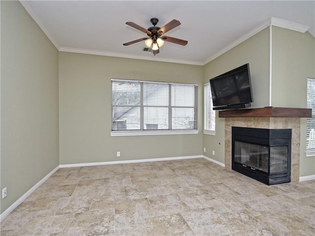 unfurnished living room with ceiling fan, crown molding, and a tiled fireplace