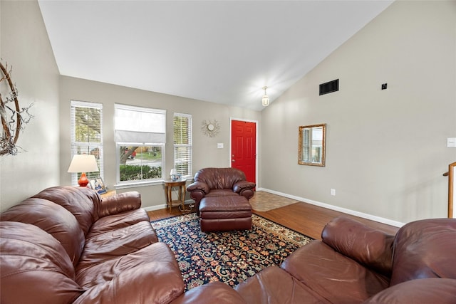 living room featuring hardwood / wood-style flooring and high vaulted ceiling