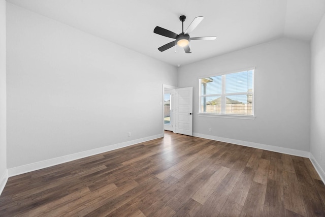 spare room with ceiling fan, dark hardwood / wood-style flooring, and vaulted ceiling