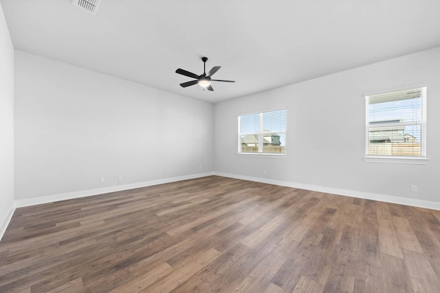 spare room featuring ceiling fan and hardwood / wood-style flooring