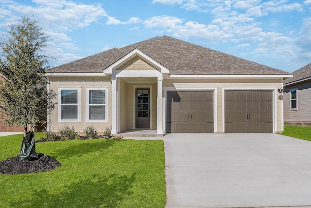 ranch-style house featuring a garage and a front lawn