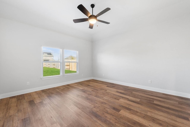 empty room with ceiling fan and hardwood / wood-style floors