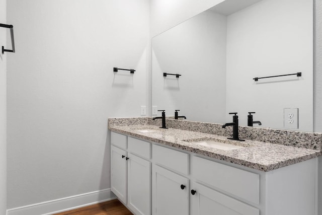 bathroom featuring hardwood / wood-style floors and vanity