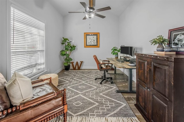 home office featuring vaulted ceiling and ceiling fan