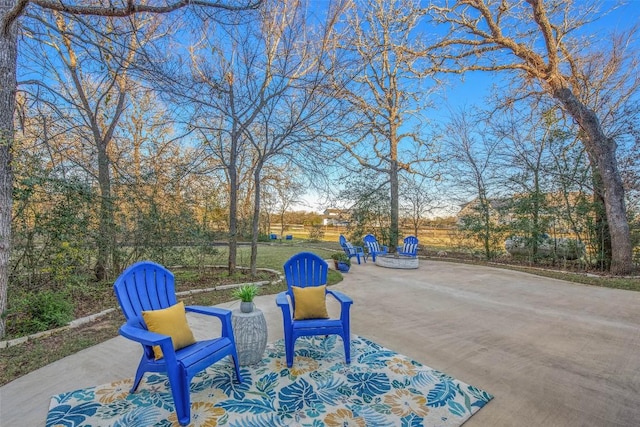 view of patio with a fire pit