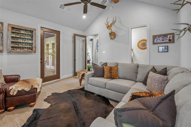 living room featuring ceiling fan and high vaulted ceiling